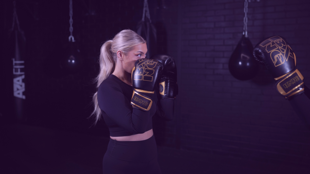 girl holding boxing gloves