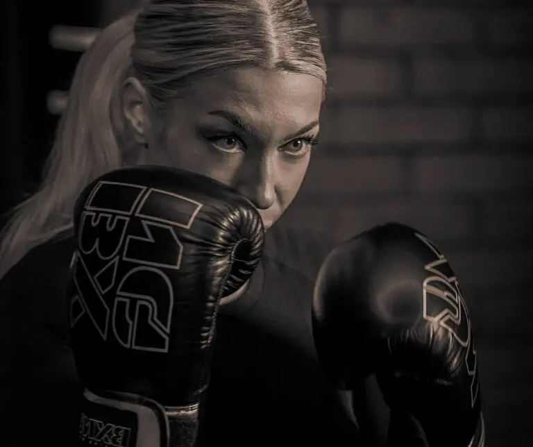 Girl posing with boxing gloves in hand