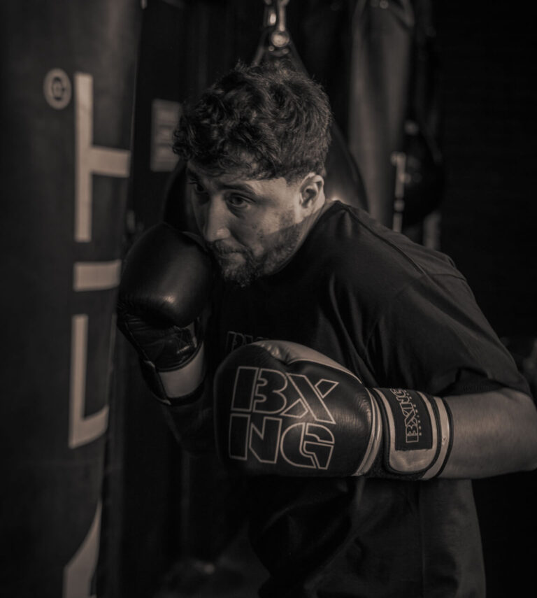 man hitting a boxing bag