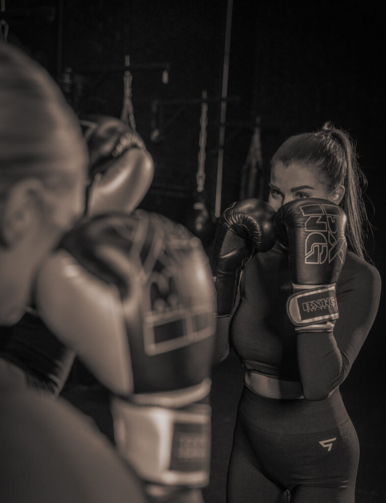 Girl holding boxing gloves